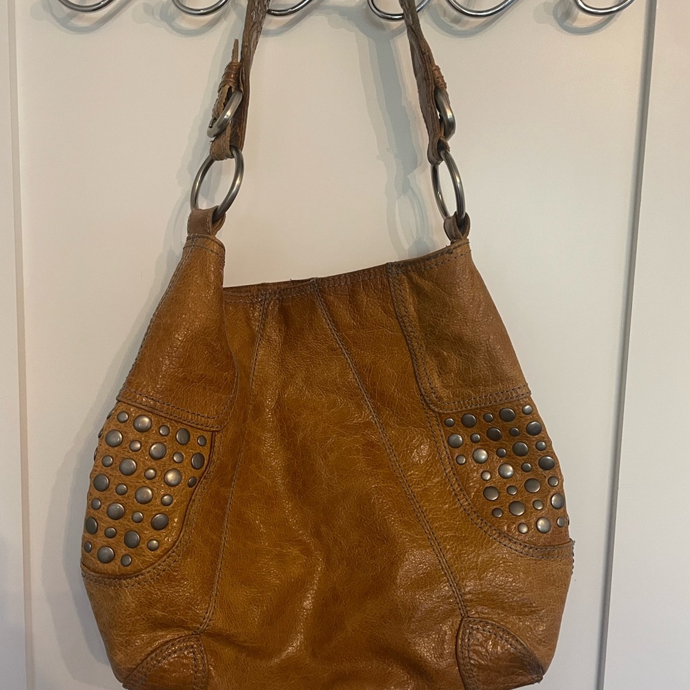 Steven by Steve Madden camel leather shoulder bag  with stud detail. 3 pockets.